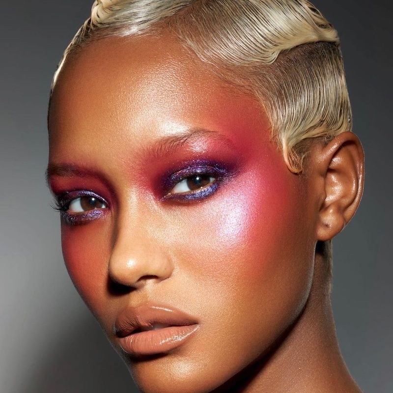 Model wearing a statement blush-centric summer makeup look