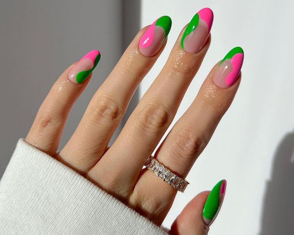 Pink and green nails with French tips and wavy side designs