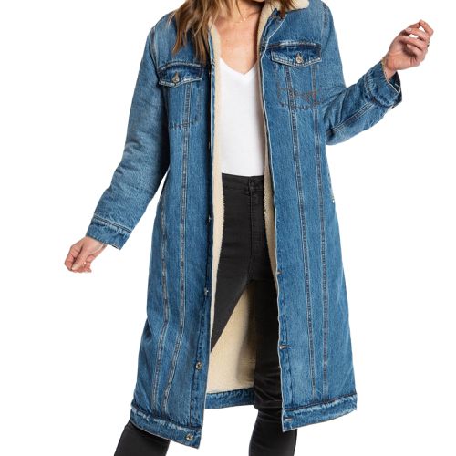 Juicy Couture Denim Longline Trucker Jacket on model paired with white top and black jeans