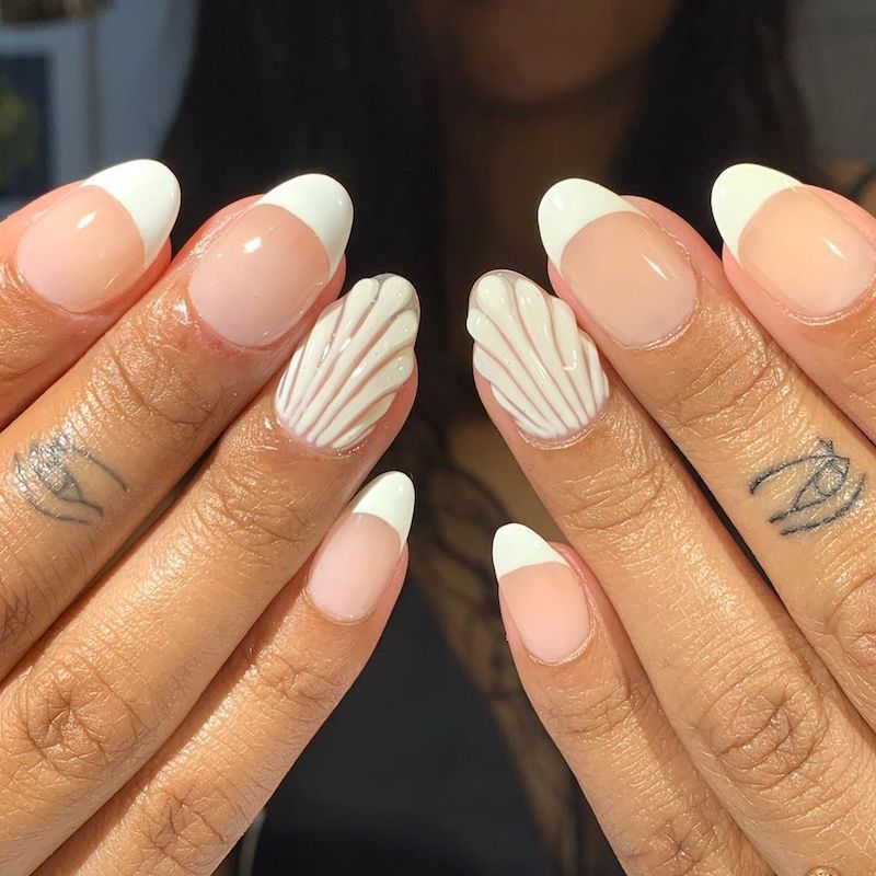 French manicure with white 3D seashell accent nails