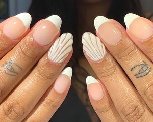 French manicure with white 3D seashell accent nails