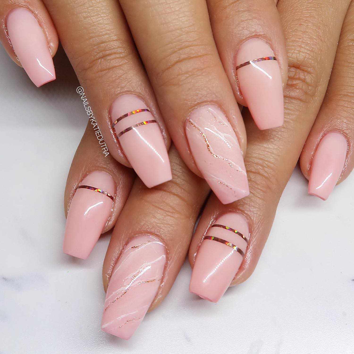 Holographic rose gold marble nail design