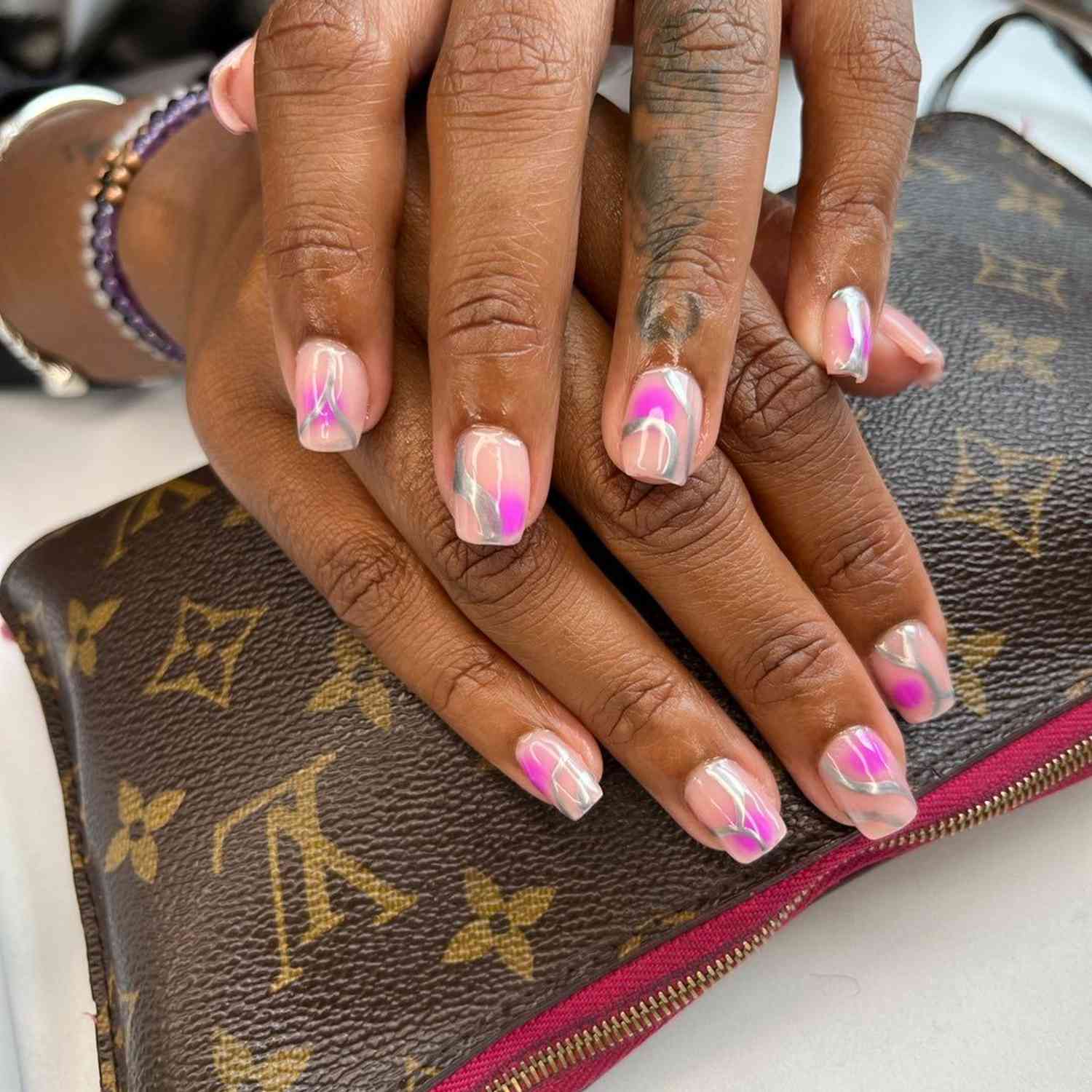 Airbrushed magenta short mani with silver chrome swirls