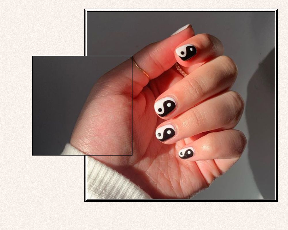 black and white yin yang nail design 