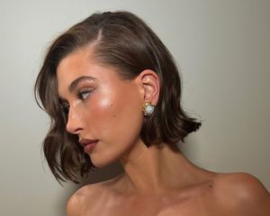 Hailey Bieber with a chin-length bob haircut, viewed in profile