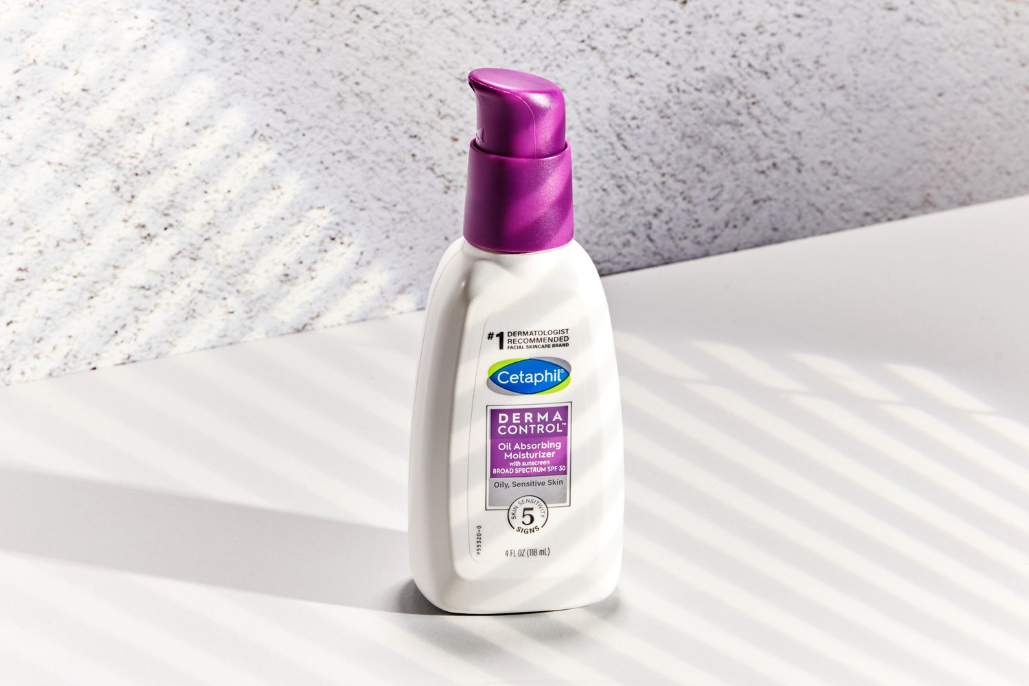 The Cetaphil DermaControl Oil Absorbing Moisturizer SPF 30 displayed on a white counter