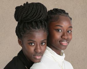 Women with Protective Hairstyles and Styled Edges