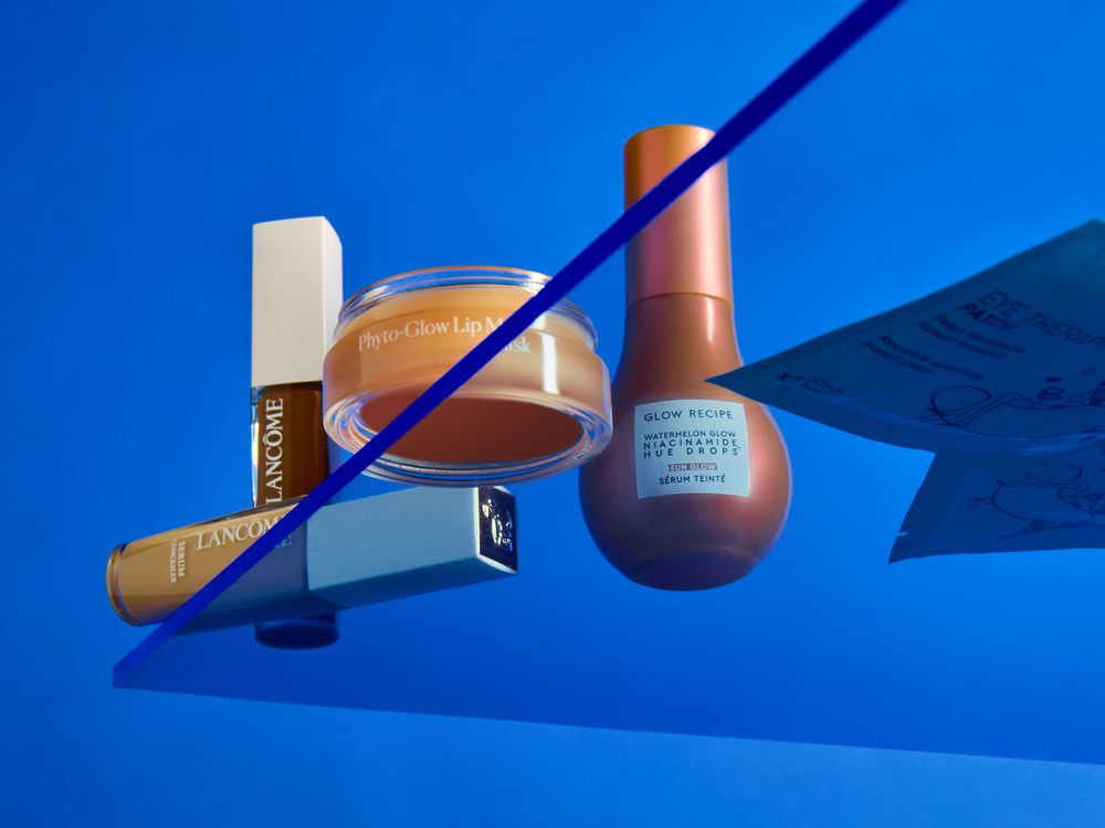 beauty products on a blue background on a plexiglass shelf lancome phyto-glow glow recipe