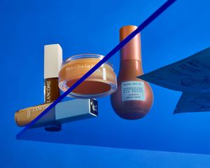 beauty products on a blue background on a plexiglass shelf lancome phyto-glow glow recipe