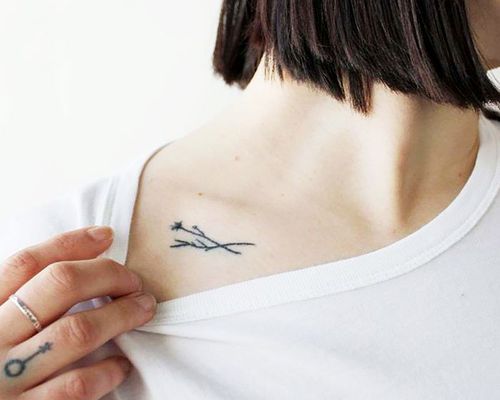 minimalist tattoo below collar bone