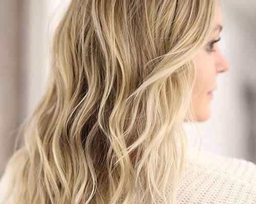 Back of woman with blonde, wavy hair