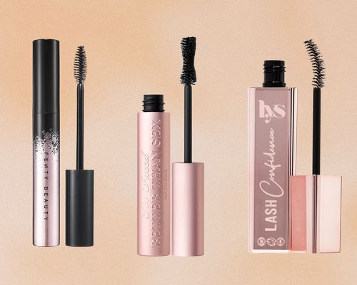 Three bottles of curling mascara on a neutral background