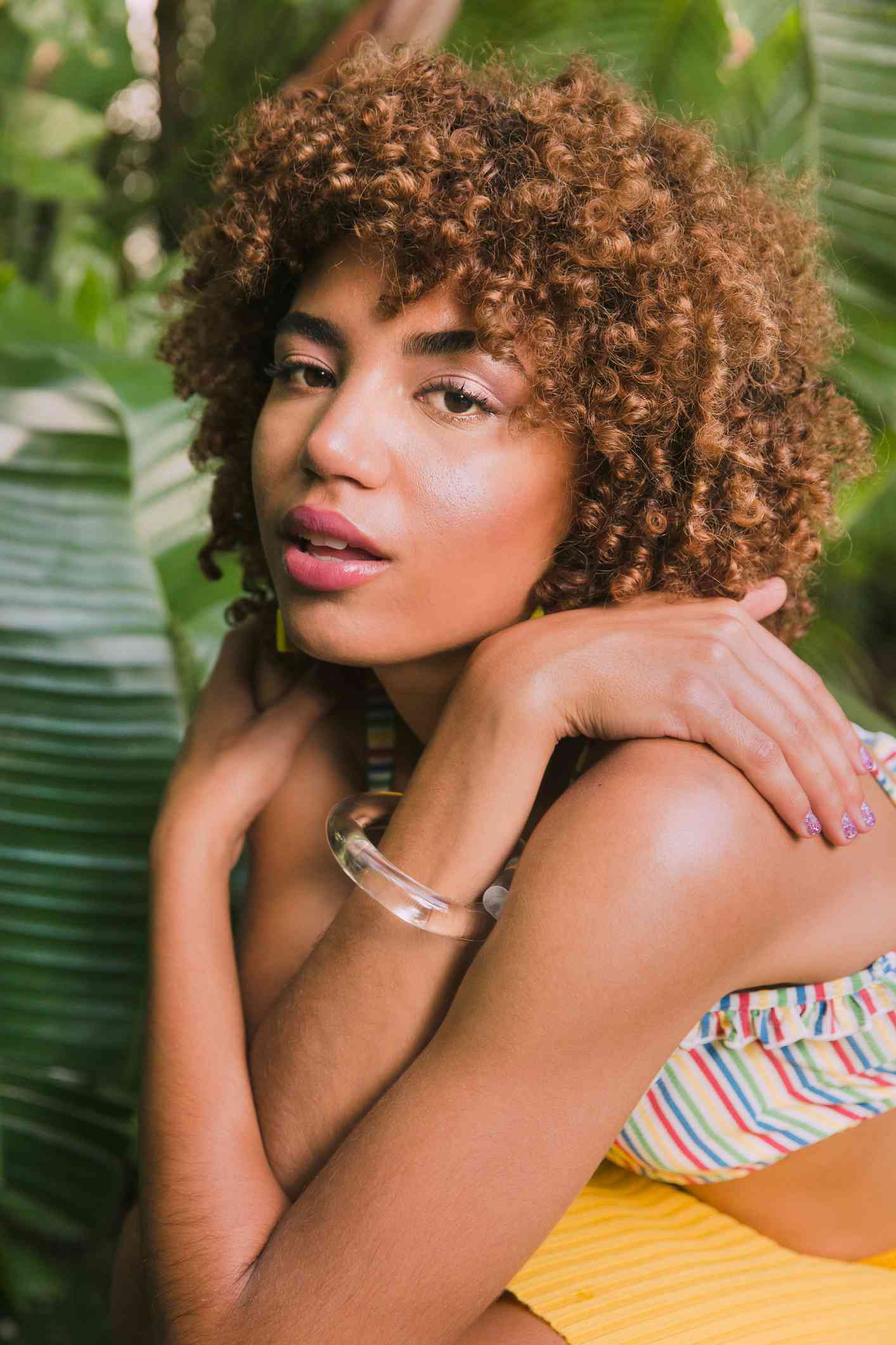 Black woman with blonde dyed curly hair