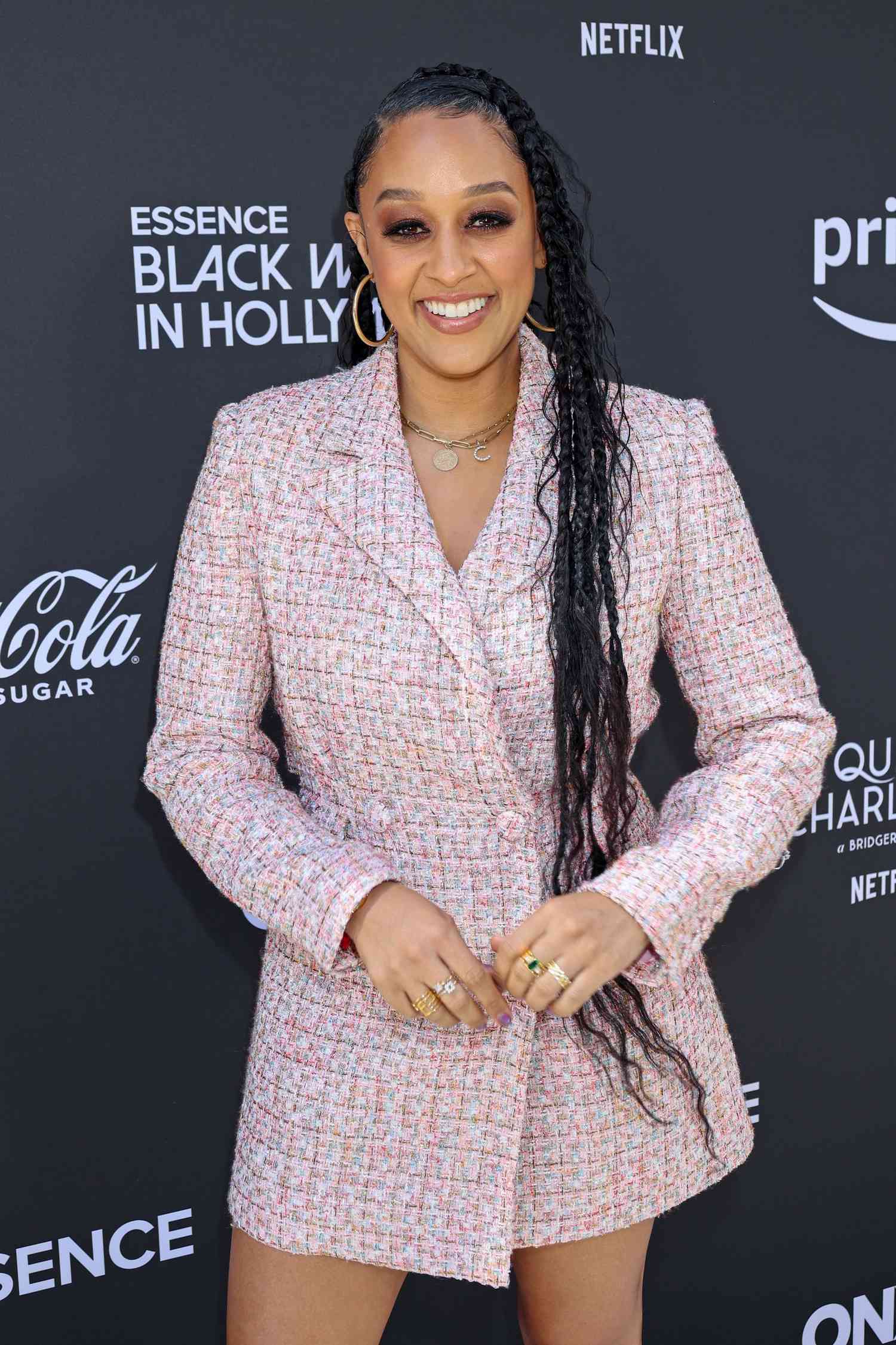 Tia Mowry wearing long goddess braids