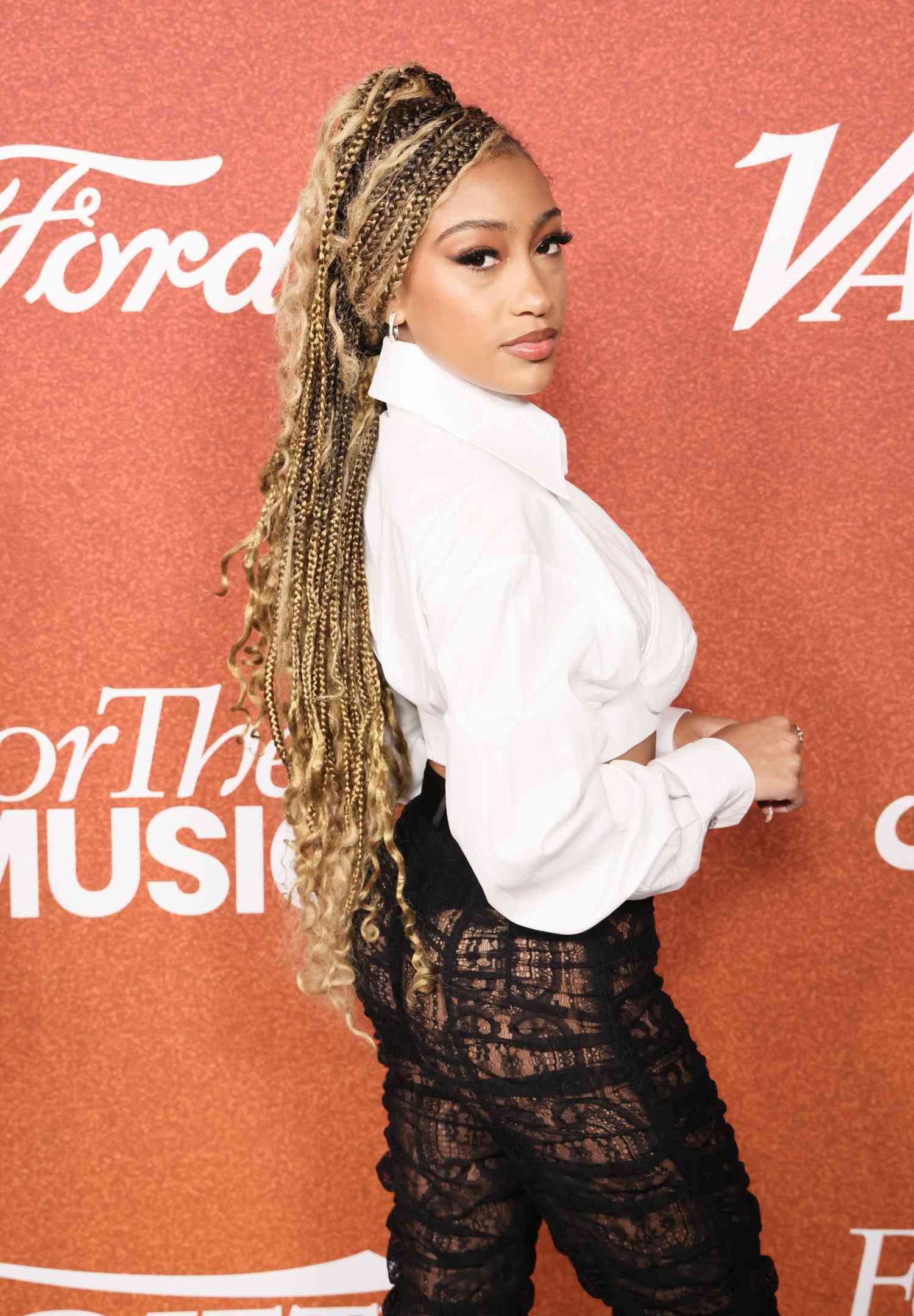 Lexi Underwood wearing long, blonde goddess braids