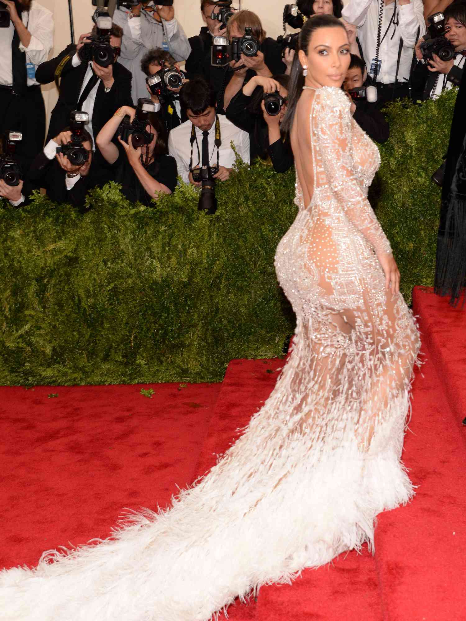 Kim Kardashian wears a white Roberto Cavalli gown to the 2015 Met Gala