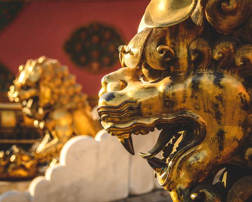 Gold lion guardian statue at the Forbidden City