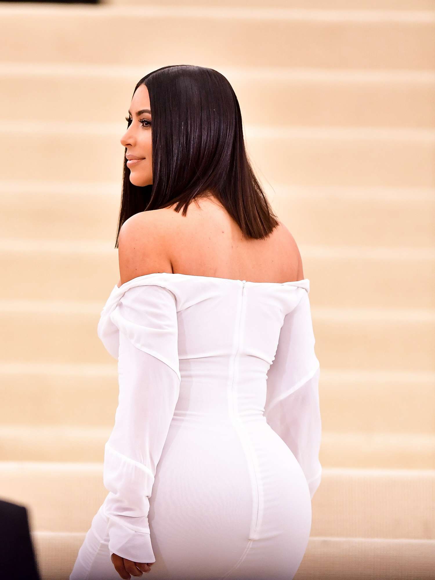 Back view of Kim Kardashian wearing a white Vivienne Westwood gown to the 2017 Met Gala