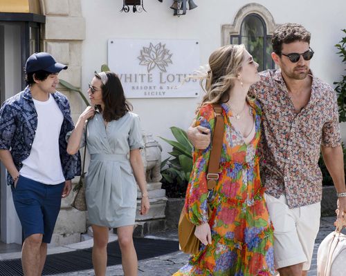 Ethan, Harper, Cameron, and Daphne in front of the White Lotus hotel