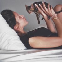 byrdie writer tanya akim holding kitten