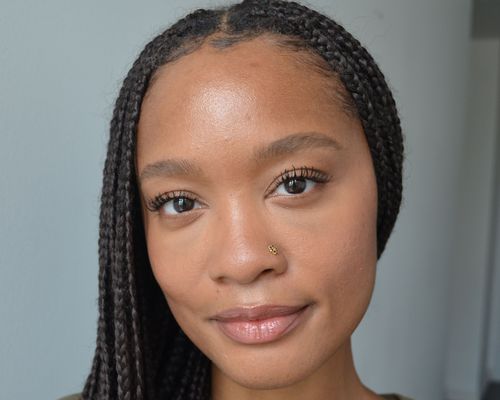 Close up of makeup artist and writer Khera Alexander with long, curled lashes