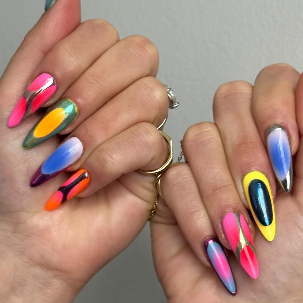 A mismatched manicure with chrome, airbrush, and ombre details