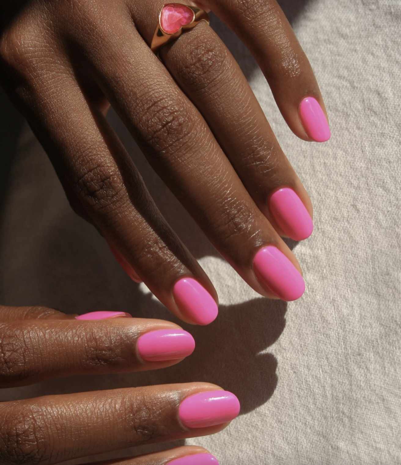 Neon pink Barbie manicure