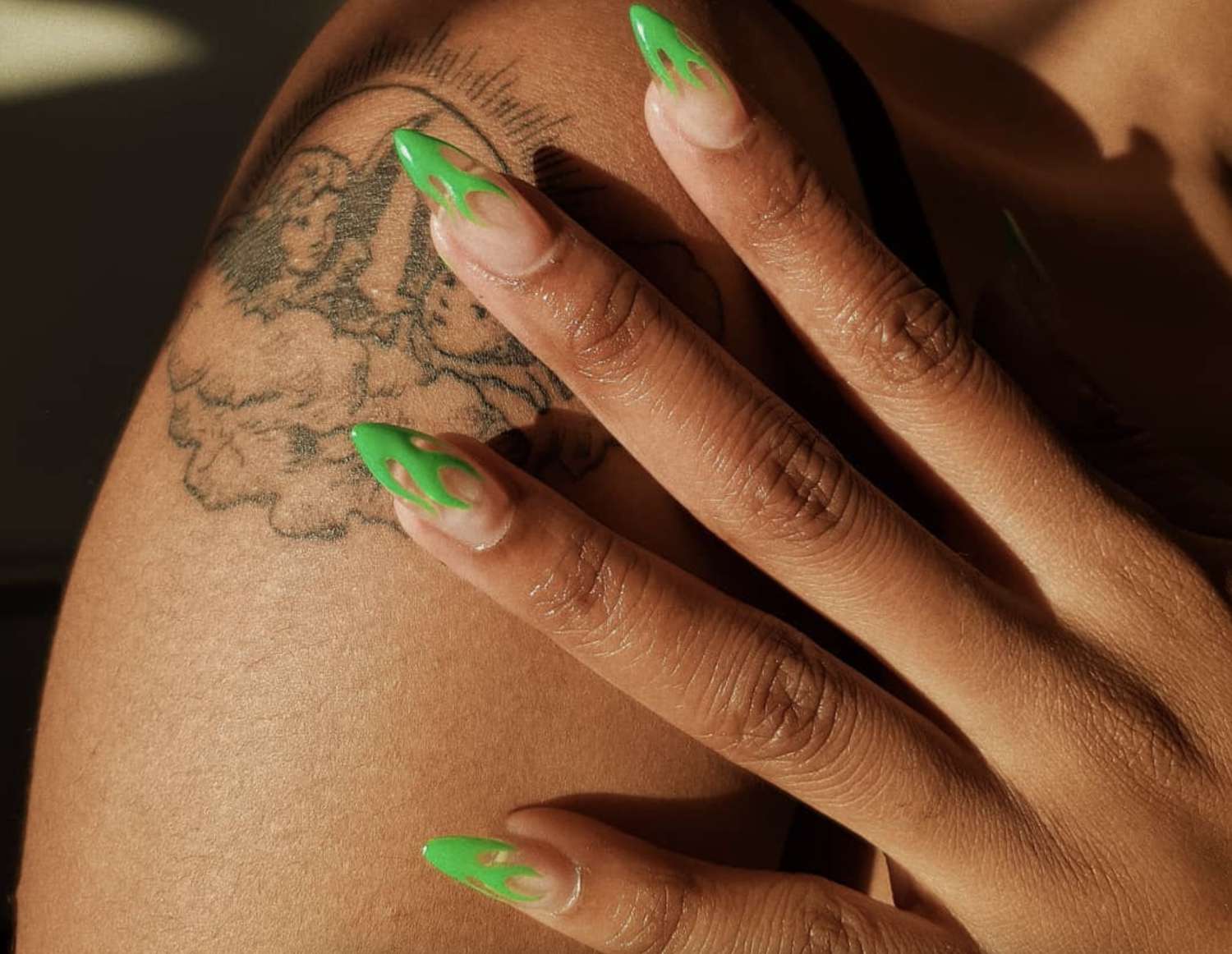 Clear acrylic nail with neon green flame tips