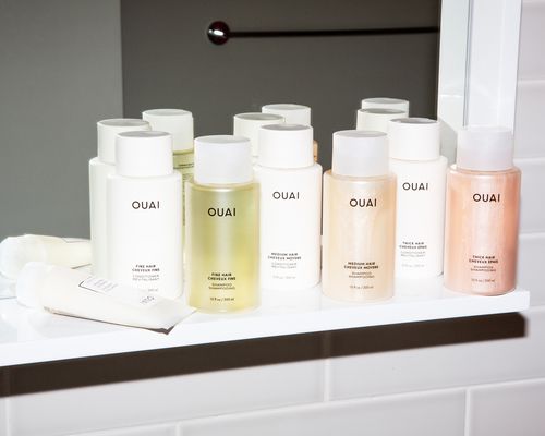 A variety of Ouai hair care products on a shelf