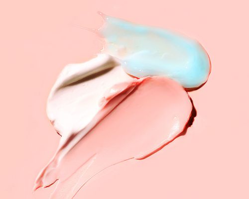 pink, blue, and white creams on pink background