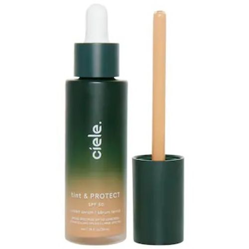 Ciele tint and protect foundation in green bottle with applicator exposed