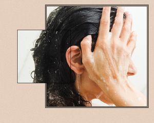 woman washing her curly hair with shampoo