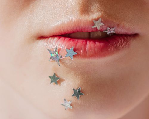 stars on woman's lower face