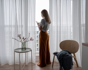 woman staring at phone