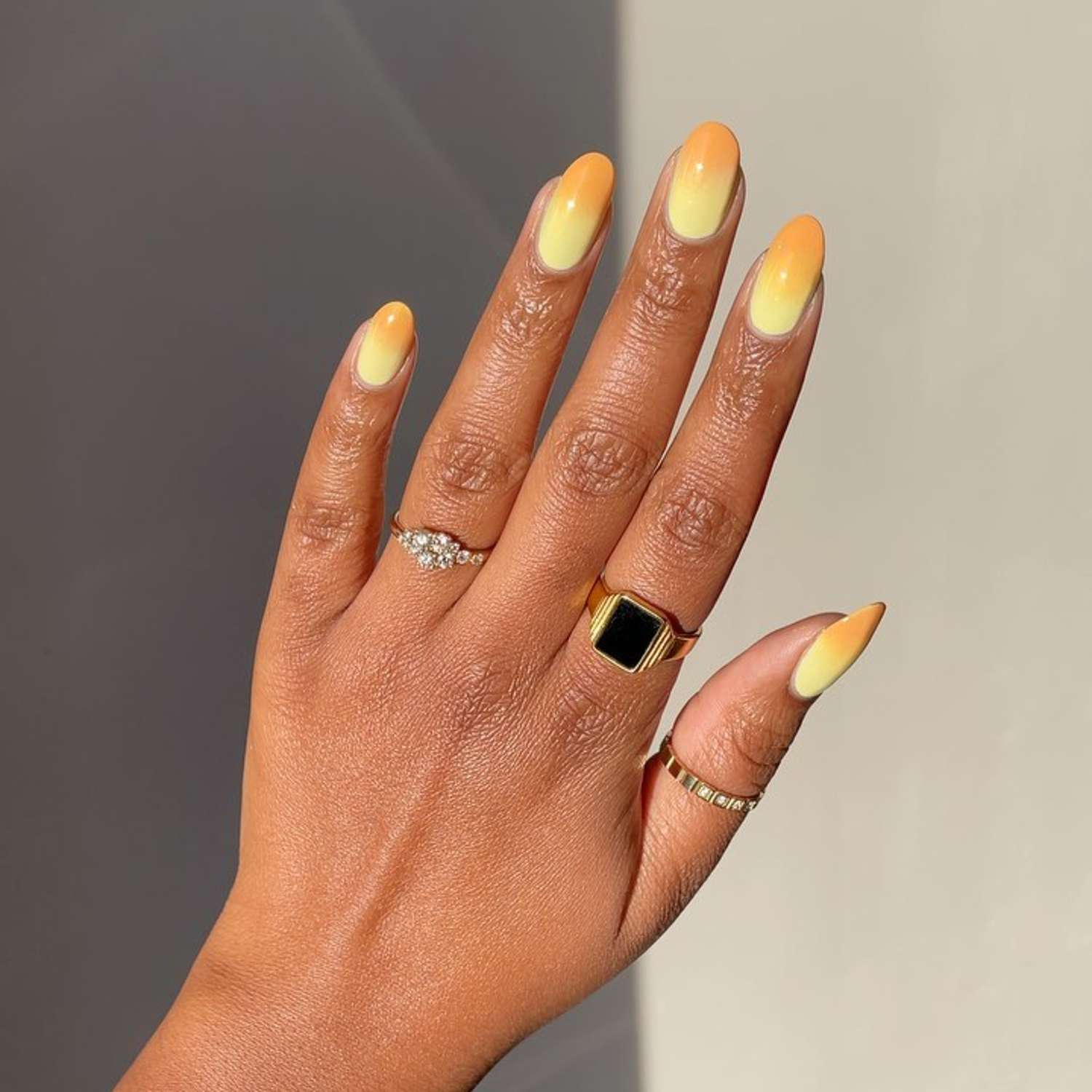 Sunshine fade nails with pale yellow melting into mustard tips