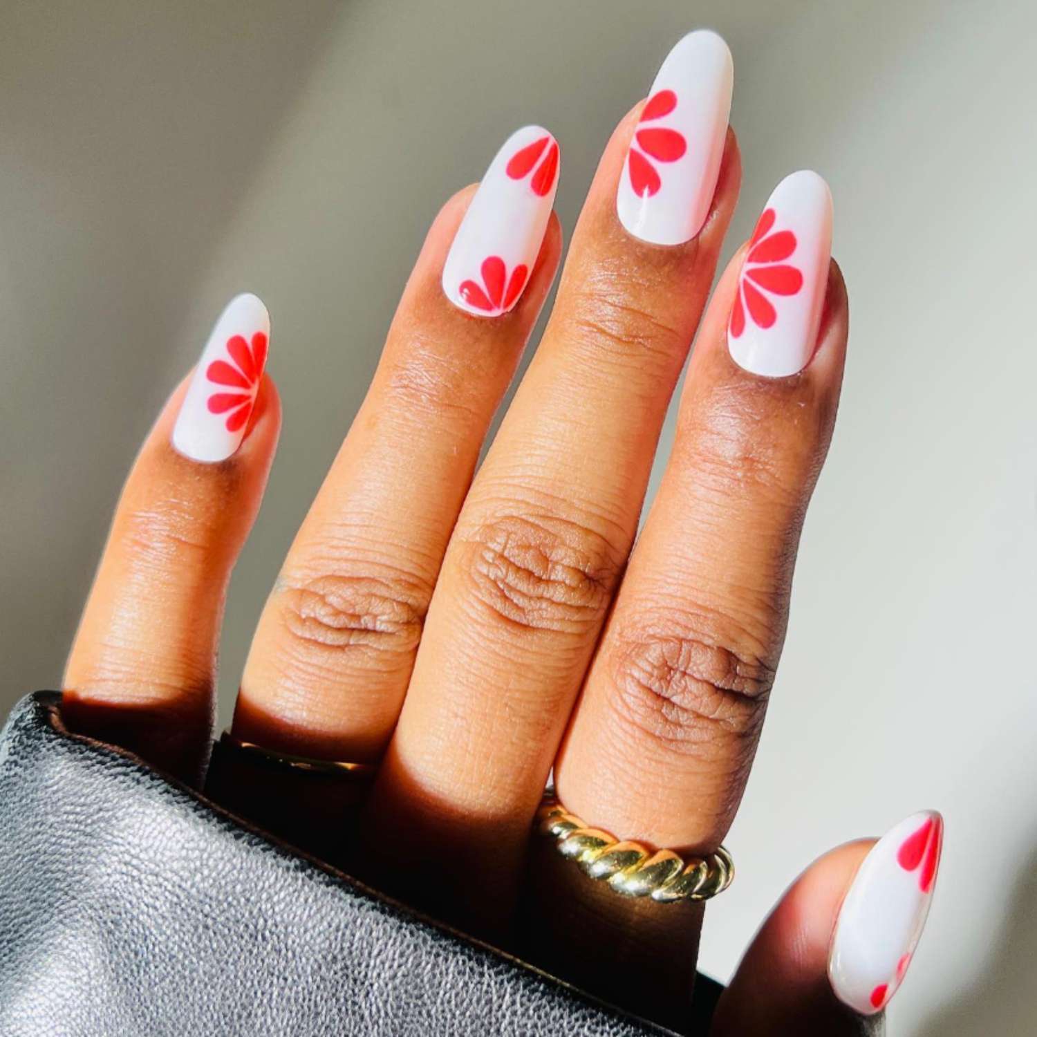 White manicure with hot pink flower designs