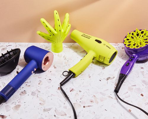 A photo of the hair dryers for curly hair displayed on a speckled surface