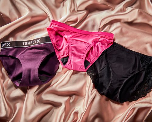 Three different pairs of period underwear on silk background