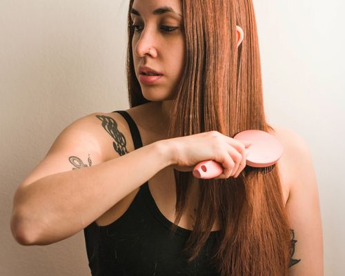 woman brushing hair