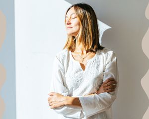 woman standing in sunlight