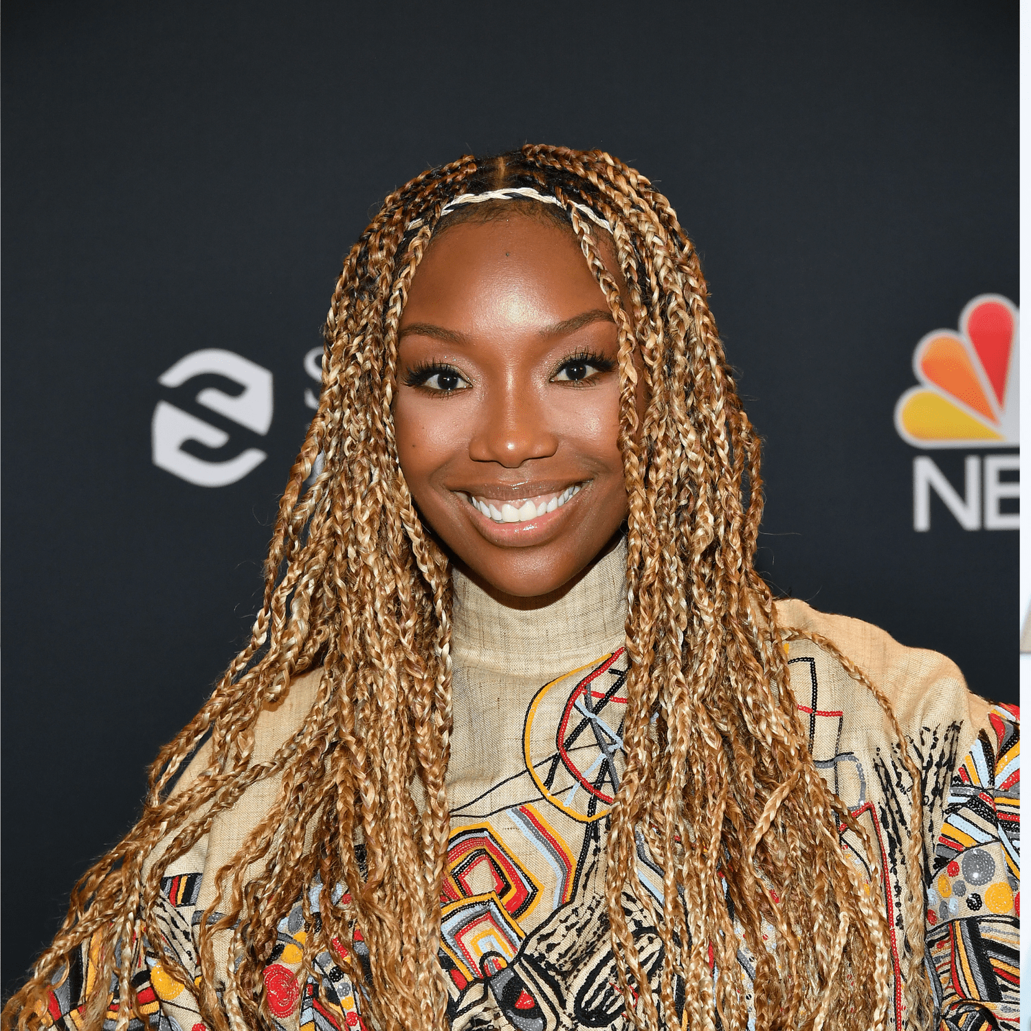 Brandy wearing long blonde box braids