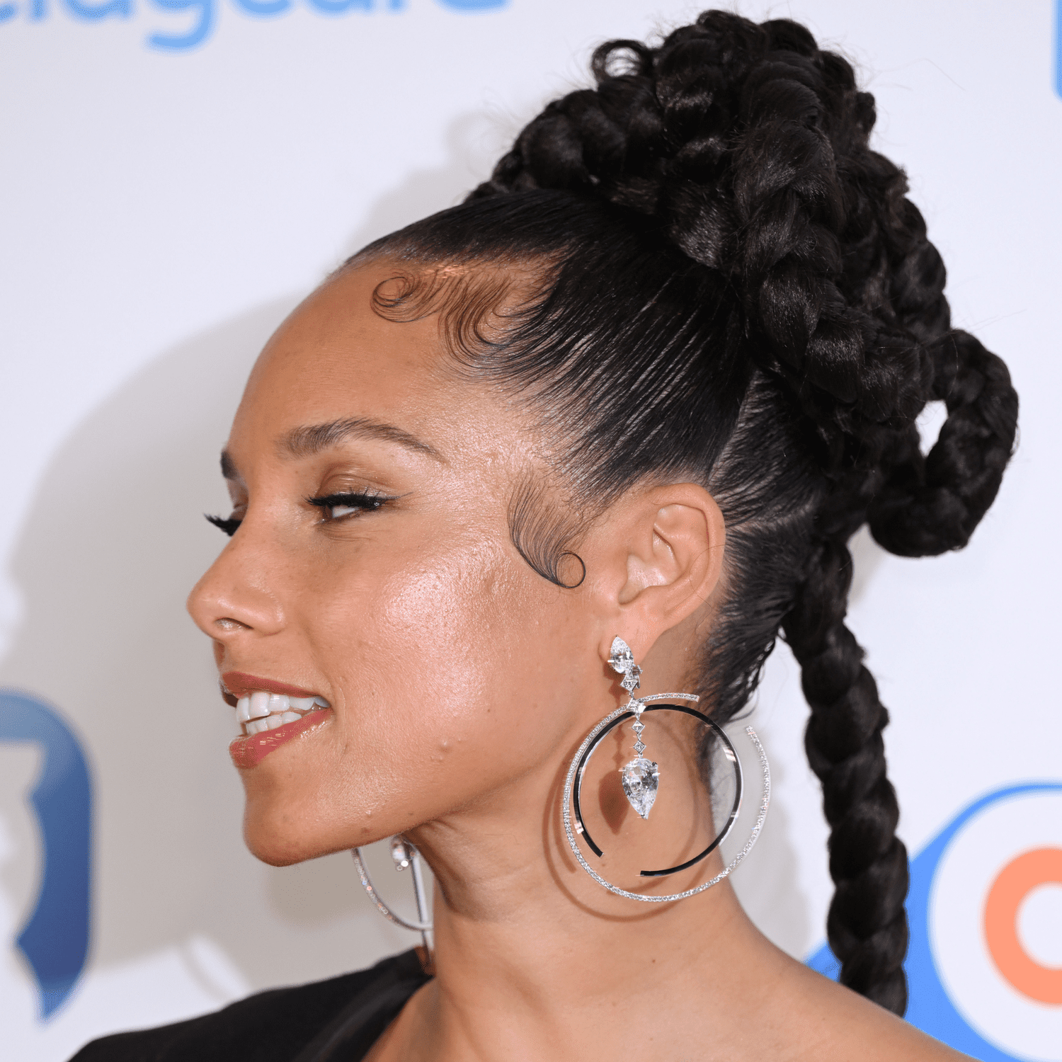 Alicia Keys with a braided updo viewed in profile