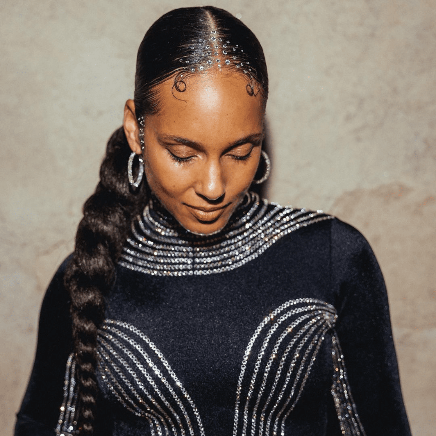 Alicia Keys with a low twisted ponytail