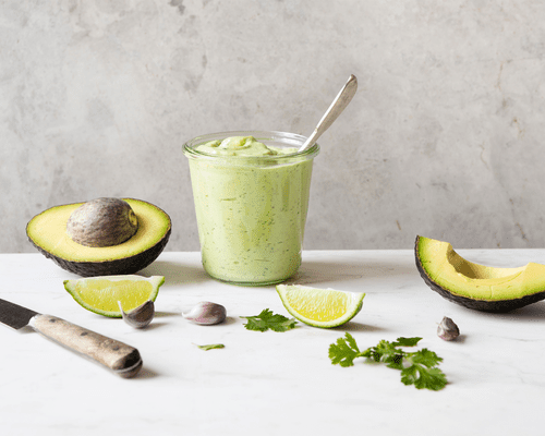 avocado slices on tan countertop