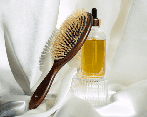 castor oil and hair brush