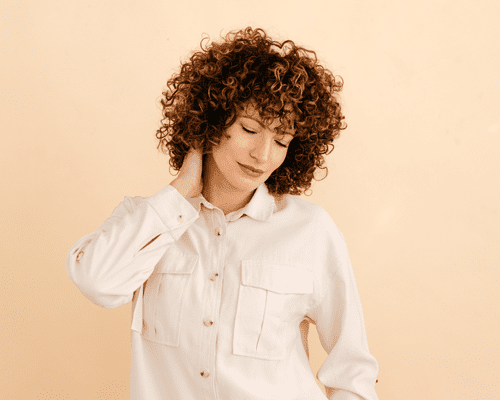 A woman with full, curly hair 