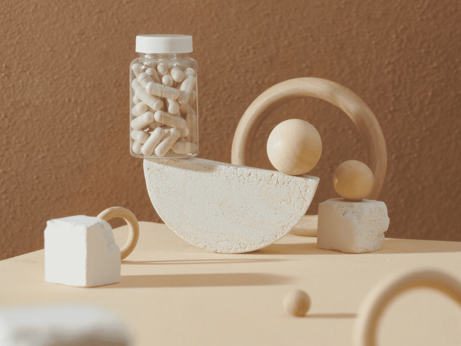 Still life of different shapes and a bottle of supplements