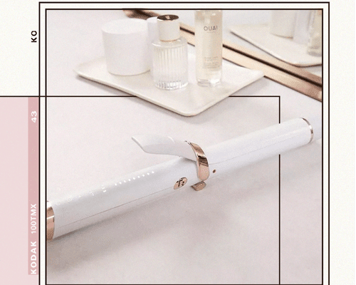 Curling Iron Sitting on a Clean White Countertop 