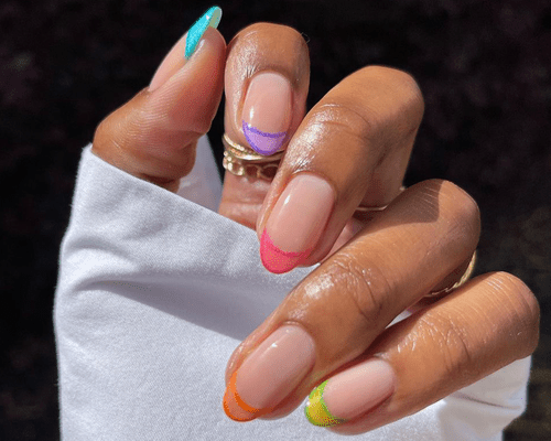 Rainbow french nails with darker color outline on the tips