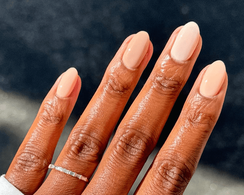 close up of woman's hand with gel manicure